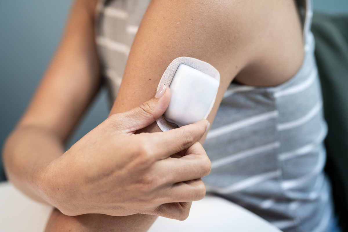 Patient in room with Pod on their left arm