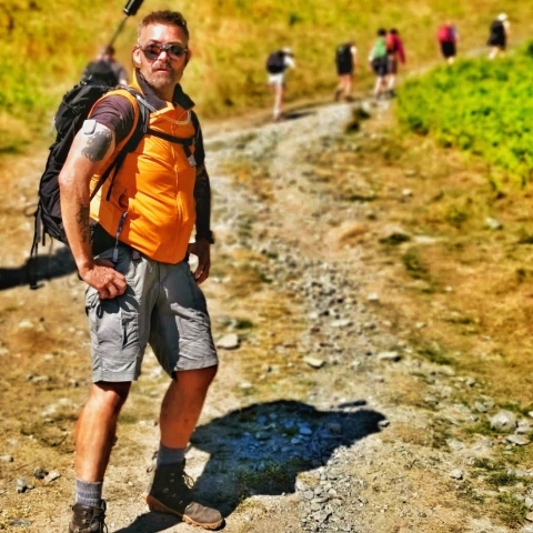 Omnipod Podder, "Paul B.," going for a hike on a steep hill